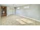 Bright bedroom featuring tiled flooring, closet, and dual windows providing ample natural light at 3902 W Iowa Ave, Tampa, FL 33616