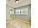 Bedroom featuring tiled flooring, closet, and window at 3902 W Iowa Ave, Tampa, FL 33616