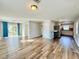 Living room open to the kitchen area and featuring sliding glass doors with natural light at 3902 W Iowa Ave, Tampa, FL 33616