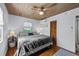 Cozy bedroom with wood-paneled ceiling, window, and hardwood floors at 4921 24Th S Ave, Gulfport, FL 33707