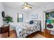 Inviting bedroom with hardwood floors, bright natural light, and decorative touches at 4921 24Th S Ave, Gulfport, FL 33707