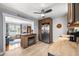 Open concept kitchen with stainless steel refrigerator, butcher block countertop and view to the living room at 4921 24Th S Ave, Gulfport, FL 33707