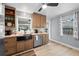 Charming kitchen featuring a black farmhouse sink, stainless steel appliances, and light wood countertops at 4921 24Th S Ave, Gulfport, FL 33707