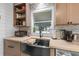 Close-up of the kitchen with stainless steel appliances, butcher block countertops, and mosaic backsplash at 4921 24Th S Ave, Gulfport, FL 33707