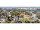 Aerial shot showcasing houses in a waterfront community, including a two-story home with a dark roof at 619 Danube Ave, Tampa, FL 33606