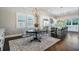 Dining Area with a modern chandelier, next to a modern kitchen with stainless steel appliances at 619 Danube Ave, Tampa, FL 33606