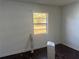 Bedroom featuring natural light and laminate wood flooring at 6347 S Lansdale Cir, Tampa, FL 33616