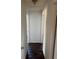 Hallway with laminate flooring, light walls and white trim at 6347 S Lansdale Cir, Tampa, FL 33616