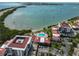 Aerial view of Isla del Sol condo featuring community pool, bay access, and parking at 6365 Bahia Del Mar Blvd # 112, St Petersburg, FL 33715