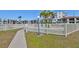 Community pool is surrounded by a fence and walkway at 6365 Bahia Del Mar Blvd # 112, St Petersburg, FL 33715