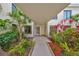 Inviting entrance surrounded by beautiful tropical landscaping at 6365 Bahia Del Mar Blvd # 112, St Petersburg, FL 33715