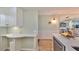 Kitchen detail featuring custom cabinetry, modern countertops, and eat in breakfast nook at 6365 Bahia Del Mar Blvd # 112, St Petersburg, FL 33715