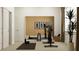 Well-lit exercise room with a large mirror, stationary bike, dumbbells, and a sleek, modern design at 6866 E 115Th St, Palmetto, FL 34221