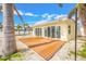 Spacious wooden deck with sliding glass doors perfect for indoor/outdoor living at 7984 1St S Ave, St Petersburg, FL 33707