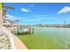 Dock with a boat lift overlooking the canal at 7984 1St S Ave, St Petersburg, FL 33707