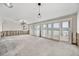 Spacious living room with large sliding doors, custom lighting, and exposed framework ready for renovation at 7984 1St S Ave, St Petersburg, FL 33707