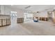 Renovation-ready living room with exposed framework, open layout, and water views through the back windows at 7984 1St S Ave, St Petersburg, FL 33707