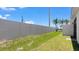 A fully fenced backyard providing security and privacy at 8069 Shore Lake Dr, Englewood, FL 34224