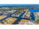 Expansive aerial view of waterfront properties with canal access to the Gulf of Mexico at 876 Callista Cay Loop, Tarpon Springs, FL 34689