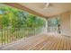 The outdoor balcony offers an open-air retreat with scenic views of the lush greenery and surroundings at 876 Callista Cay Loop, Tarpon Springs, FL 34689