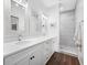 Modern bathroom with double vanity, tile shower, and contemporary finishes throughout at 876 Callista Cay Loop, Tarpon Springs, FL 34689