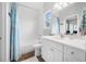 Bright bathroom featuring a white vanity, modern fixtures, and subway tile backsplash at 876 Callista Cay Loop, Tarpon Springs, FL 34689