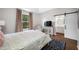 Comfortable bedroom with ensuite bathroom, ceiling fan, and lots of natural light at 876 Callista Cay Loop, Tarpon Springs, FL 34689