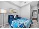 Comfortable bedroom with a cozy bed, accent pillows, and carpet flooring at 876 Callista Cay Loop, Tarpon Springs, FL 34689