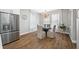 Bright dining area features natural light, a stainless steel fridge, and a contemporary chandelier at 876 Callista Cay Loop, Tarpon Springs, FL 34689