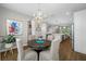 Charming dining area offers a decorative chandelier, space for seating, and a view into the adjoining rooms at 876 Callista Cay Loop, Tarpon Springs, FL 34689