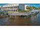 Exterior of dock along the water with multi-story condominiums in the background at 876 Callista Cay Loop, Tarpon Springs, FL 34689