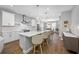 Bright, open kitchen with a large island, pendant lighting, modern appliances, and bar stool seating at 876 Callista Cay Loop, Tarpon Springs, FL 34689