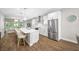 Modern kitchen featuring stainless steel appliances, a large island with seating, and an open layout at 876 Callista Cay Loop, Tarpon Springs, FL 34689