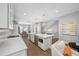 Spacious kitchen with a center island featuring a built-in wine cooler and stainless steel appliances at 876 Callista Cay Loop, Tarpon Springs, FL 34689