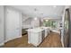 Spacious kitchen boasts a large central island, stainless steel appliances, and an open layout at 876 Callista Cay Loop, Tarpon Springs, FL 34689