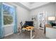 Bright office space with a large window and neutral walls, perfect for working from home at 876 Callista Cay Loop, Tarpon Springs, FL 34689