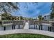 Community wooden walkway between the buildings to the docks in the water at 876 Callista Cay Loop, Tarpon Springs, FL 34689