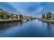 Beautiful waterfront condos with boat docks under a cloudy blue sky at 876 Callista Cay Loop, Tarpon Springs, FL 34689