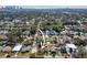 Aerial view of a property with clearly defined lot lines, surrounded by lush greenery and mature trees at 902 W Fribley St, Tampa, FL 33603