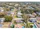 Aerial view of a property highlighting location in neighborhood with mature trees and brick-paved roads at 902 W Fribley St, Tampa, FL 33603