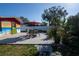 Paver patio with outdoor seating and lush landscaping in backyard at 1091 Mcfarland St, Dunedin, FL 34698