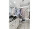 Bathroom featuring a modern vessel sink, shower, and stylish coastal decor at 1091 Mcfarland St, Dunedin, FL 34698