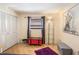 Bright bedroom with white closet doors, a window with curtains, and decorative accents at 1091 Mcfarland St, Dunedin, FL 34698