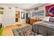 Bedroom featuring neutral decor, a large window, and access to an en-suite bathroom at 1091 Mcfarland St, Dunedin, FL 34698