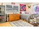 Bright bedroom featuring natural light from a window, a cozy rug, and dresser at 1091 Mcfarland St, Dunedin, FL 34698