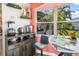 Bright breakfast nook featuring a sunny bay window and stylish furniture, perfect for morning coffee at 1091 Mcfarland St, Dunedin, FL 34698