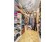 Walk-in closet with shelving and rod space for clothing and shoe storage at 1091 Mcfarland St, Dunedin, FL 34698