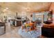 Open dining area with wood ceiling, open floor plan, view of the kitchen, and a rustic chandelier at 1091 Mcfarland St, Dunedin, FL 34698