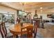 Open concept dining area with wood ceiling, modern lighting, and access to a screened porch at 1091 Mcfarland St, Dunedin, FL 34698