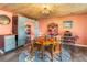 Eclectic dining room featuring a wood ceiling, round table, and colorful accents at 1091 Mcfarland St, Dunedin, FL 34698